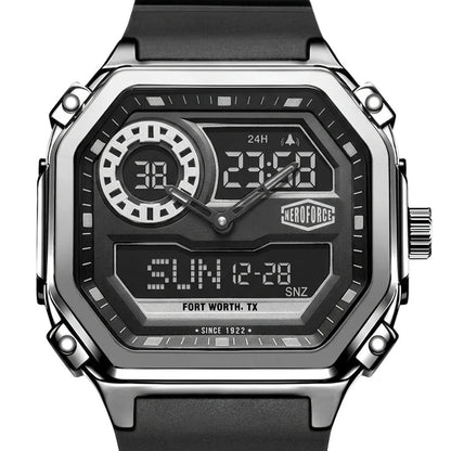 A rugged analog-digital wristwatch with a black strap, silver-tone metal case, and a black face featuring white and gray digital displays and markings. The HEROFORCE brand logo is visible on the watch face.