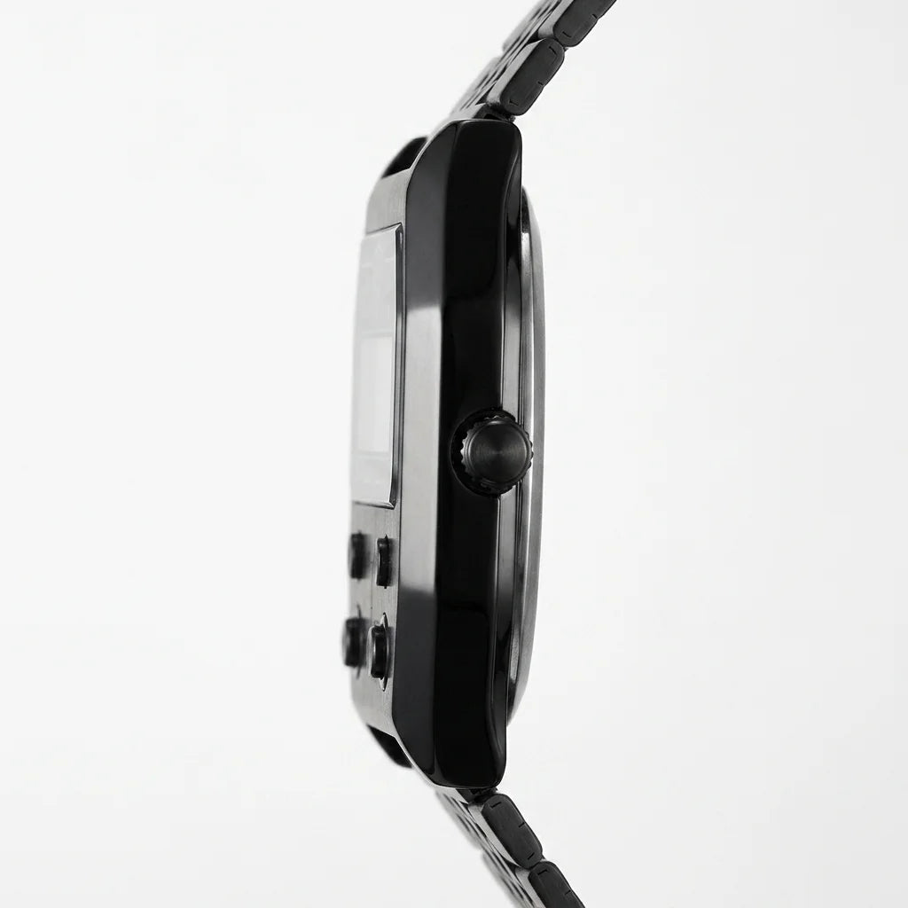 Side profile of Black metallic digital wristwatch with rectangular face and green backlit display