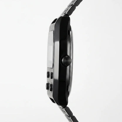 Side profile of Black metallic digital wristwatch with rectangular face and green backlit display