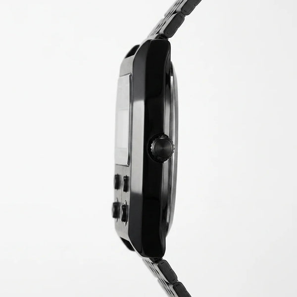 Side profile of Black metallic digital wristwatch with rectangular face and green backlit display
