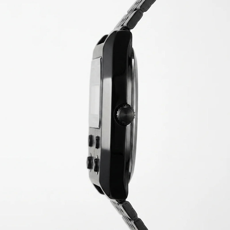 Side profile of Black metallic digital wristwatch with rectangular face and green backlit display