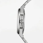 Side profile view - Stainless steel wristwatch with turquoise sunburst dial, silver markers, and small seconds subdial
