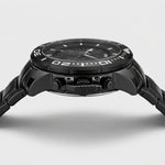 Side profile view of Black stainless steel watch with black geometric dial, oversized bezel, and metal bracelet