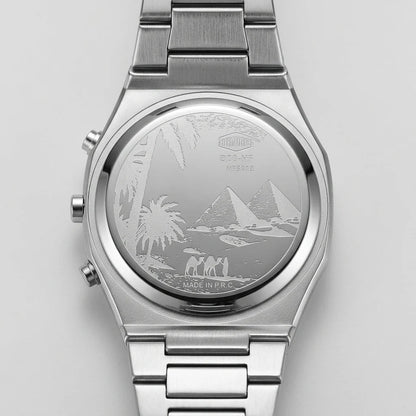 Silver stainless steel wrist watch with a metal link bracelet, featuring an engraved Egyptian desert scene on the back case with pyramids, palm trees, and figures.