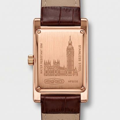 The back of a rectangular rose gold watch with a brown leather strap