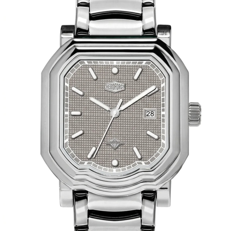 Upclose view - Silver wristwatch with octagonal rectangular case, metallic bracelet, gray textured dial, silver markers, and date window