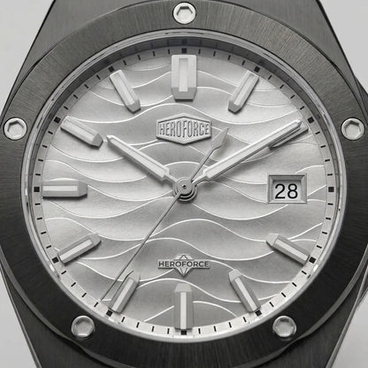 Upclose view of A men's analog watch with a black metal case and link bracelet, featuring a silver dial with a wavy pattern, silver hour markers