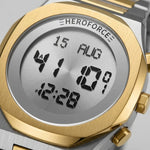 Upclose view of Round digital wristwatch with alternating silver and gold segmented band, gold bezel, and three gold side buttons