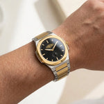 Watch on wrist - Silver and Gold Stainless Steel Watch with Black Dial and Small Seconds