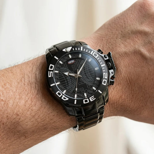 Wrist worn of Black stainless steel watch with black geometric dial, oversized bezel, and metal bracelet