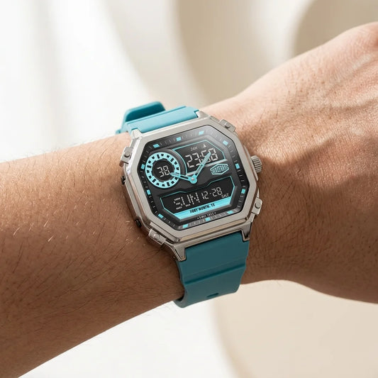 Wrist worn of Rectangular wristwatch with metallic case, turquoise strap, and geometric analog-digital face with turquoise accents.