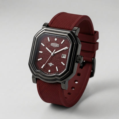 A rugged octagonal analog watch with a dark gunmetal gray case, a textured burgundy dial