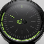 A close-up of a black green smartwatch with a black strap