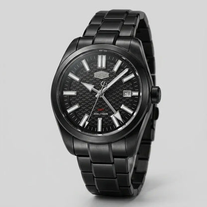 A HeroForce wristwatch with a matte black metal case and link bracelet, featuring a textured black dial with silver-tone indices and hands, a date window at 3 o'clock, and a small red 'GNT' accent.