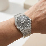watch on wrist grey dial