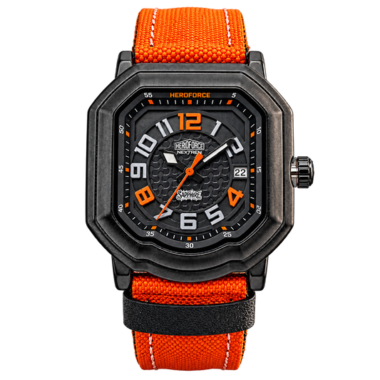 A rugged octagonal analog watch with a black textured case, black dial with orange and white details, and an orange woven fabric strap with white stitching, shown on a plain white background.
